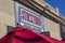 A white and red Stockyard Burgers and Bones sign on a brown buildings in Marietta Georgia