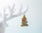 White reindeer antler with Christmas decoration on white background. Christmas or New Year minimal concept
