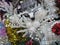 A white reindeer Christmas ring flower wreath on display