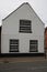 White rendered triangular shaped house UK