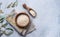 White rice Arborio  in a wooden bowl on a napkin on a light blue background