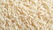 White rice grains. Textured background. Top view. Copy space. Concept of uncooked food, dietary staple, cereal grain