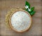 white rice Thai Jasmine rice in the wooden bowl and unmilled rice isolated on the sack cloth,