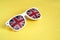 White rimmed sunglasses with UK flag on a yellow isolated background. Selective focus. Free space for your text