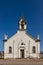 White rock chapel at blue sky background.