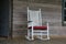 White rocking chair in abandoned cabin in Alabama.