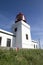 White romantic lighthouse on the cliff, west Madeira island, village Ponta do Pargo, Portugal, Atlantic ocean