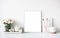 White room interior decor with burning candle, poster mockup and