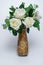 White roses,artificial flowers in a decorative vase
