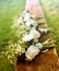 White roses on a bench before a country wedding