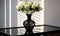 White Roses in a Black Lace Vase on a Glass Table. Elegant Simplicity