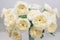 White roses with green middle is an original selection of a large bouquet on sale in the flower market. Modern elite