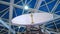 White rotating satellite dish antenna using to receive or transmit information