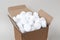 White round dishwasher salt tablets in a box. Set of white capsules