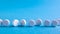 White round medical pills on a blue background. Scattered white pills on the table. The concept of medicine, pharmacy and