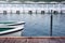 White rowboat moored near shore in the lake