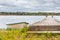 White Rowing Boat Next to Wooden Pier