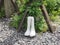 White rubber boots on the rocks in the garden.