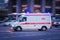 White Russian state ambulance van quickly crosses a wide Moscow street. White ambulance Mercedes-Benz emergency vehicles