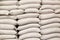 White sacks of rice in rice mill