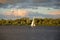 White sail and dramatic apocaliptic sky, Dnepr river