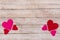 White Saint Valentine`s day background with red and pink hearts, copy space
