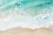 white sand beach background with turquoise sea water and small waves making white foam. summer, vacation, tropical and relax