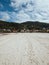 White sand beach in a forested island with a small town