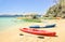 White sand beach with longtail boats and kayaks in Coron Palawan - Beautiful tropical destination in Philippines - Travel concept