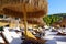 White sand beach with sunbeds and bamboo umbrella. Beautiful tropical beach in Turkey