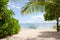 White sand beach and tropical trees. Boat for tourists