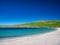 The white sand and turquoise water of Spiggie Beach Scousburgh Beach in southern Shetland, UK. Taken on a sunny day with a clear