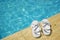 White sandals at the poolside