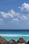 White sandy beach in the Caribbean with rows of huts