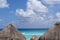 White sandy beach in the Caribbean with rows of huts