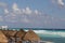 White sandy beach in the Caribbean with rows of huts