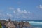 White sandy beach in the Caribbean with rows of huts