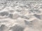 White sandy beach dune with seagull footprints
