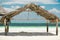 White sandy tropical beach with shed standing near