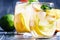 White sangria with fruit and ice, gray-silver background, select