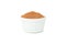 White sauceboat with cinnamon powder isolated