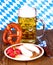 White sausage with mustard, pretzel, beer and radish