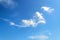 White scenic translucent cirrus cloud high in the blue summer sky. Different cloud types and atmospheric phenomena