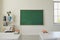 White school classroom interior. Bright lassroom with windows tables chair green board