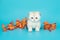 White, Scottish fold kitten and autumn leaves