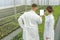 White screen Tablet greenhouse. Agricultural Engineers using tab