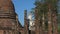 White sculpture of Buddha on the ruins of an Buddhist temple. Sukhothai