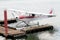 White sea plane moored at the dock.