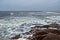 White sea storm landscape with stones