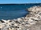 White seagulls on rocky shoreline